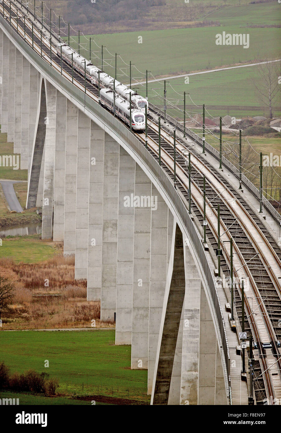 Two ICE express trains ride alongside each other during the dedication