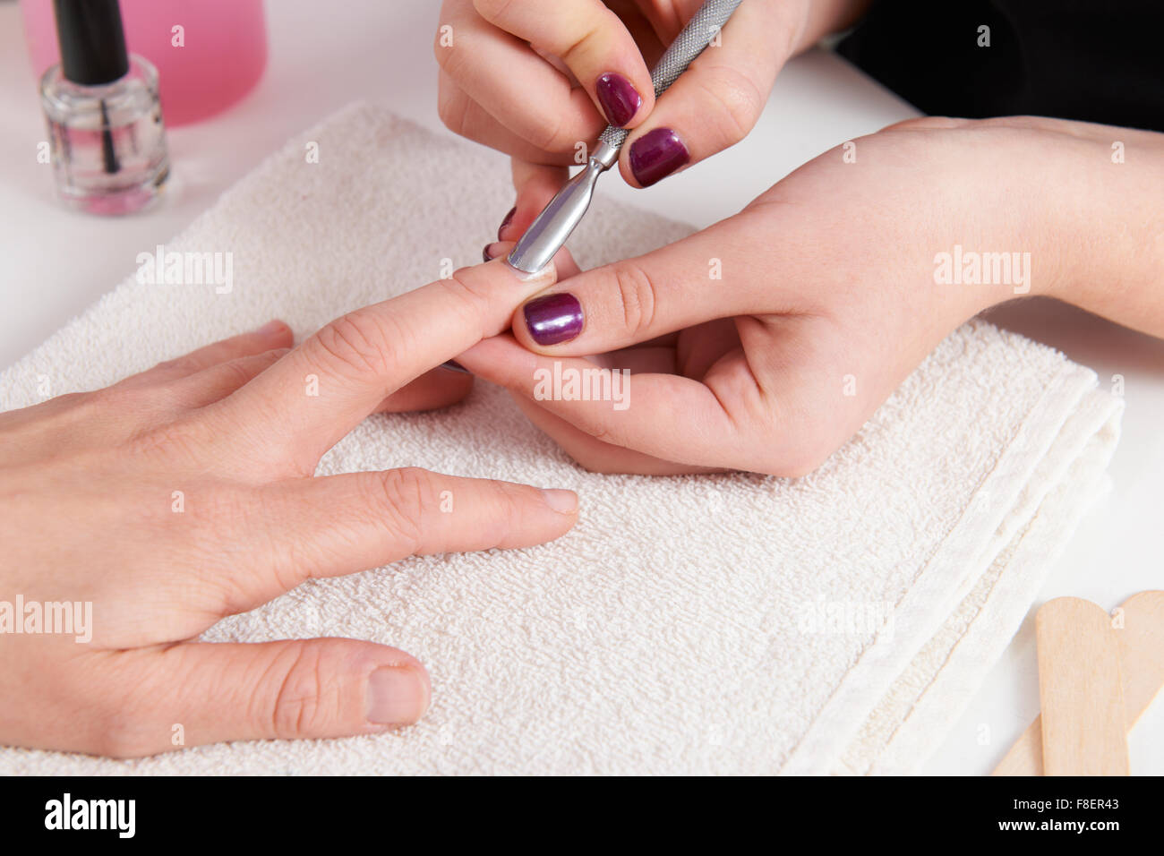 Woman Having Manicure At Beauty Salon Stock Photo