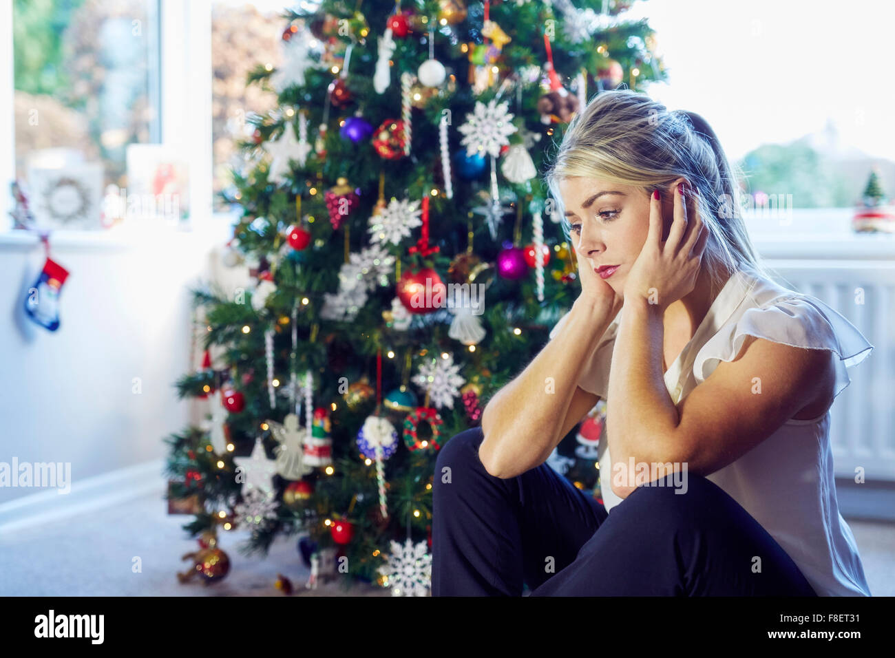 Woman sat alone at Christmas Stock Photo Alamy Alone At Christmas