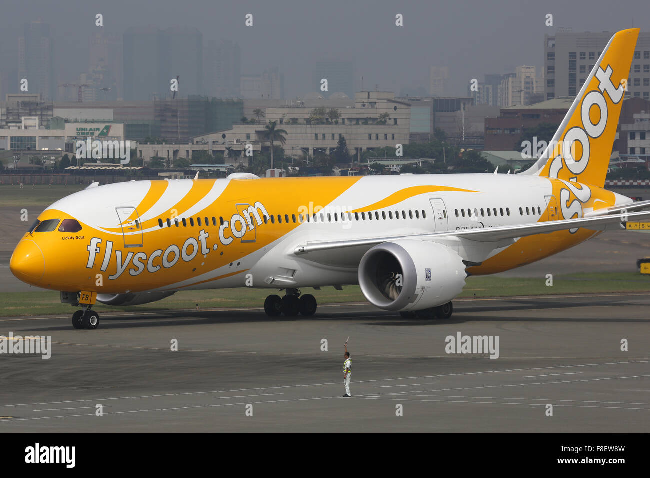 Kaohsiung, Taiwan - October 17, 2015: A Scoot Boeing 787-8 Dreamliner with the registration 9V-OFB taxis at Kaohsiung Airport (K Stock Photo