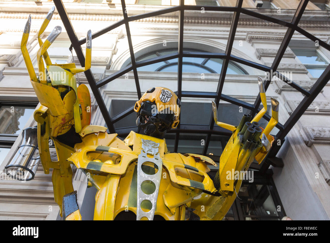 London, UK. 9 December 2015. A giant yellow Transformer character. Press launch of the 2016 London's New Year's Day Parade at the Corinthia Hotel. The motto for 2016 is 30 Magical Years. Credit:  Vibrant Pictures/Alamy Live News Stock Photo