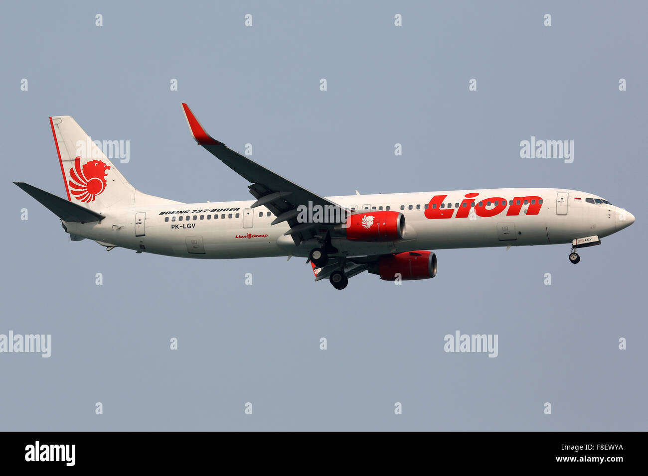 Singapore - October 21, 2015: A Lion Air Boeing 737-900ER with the registration PK-LGV approaches Singapore Airport (SIN). Lion Stock Photo