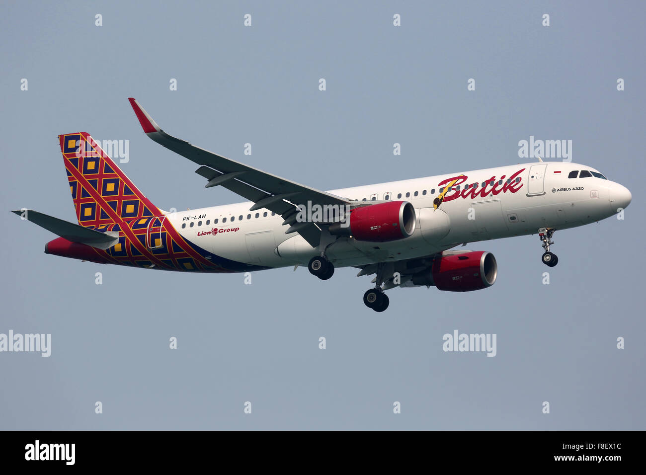 Singapore - October 21, 2015: A Batik Air Airbus A320 with the registration PK-LAH on approach to Singapore Airport (SIN). Batik Stock Photo