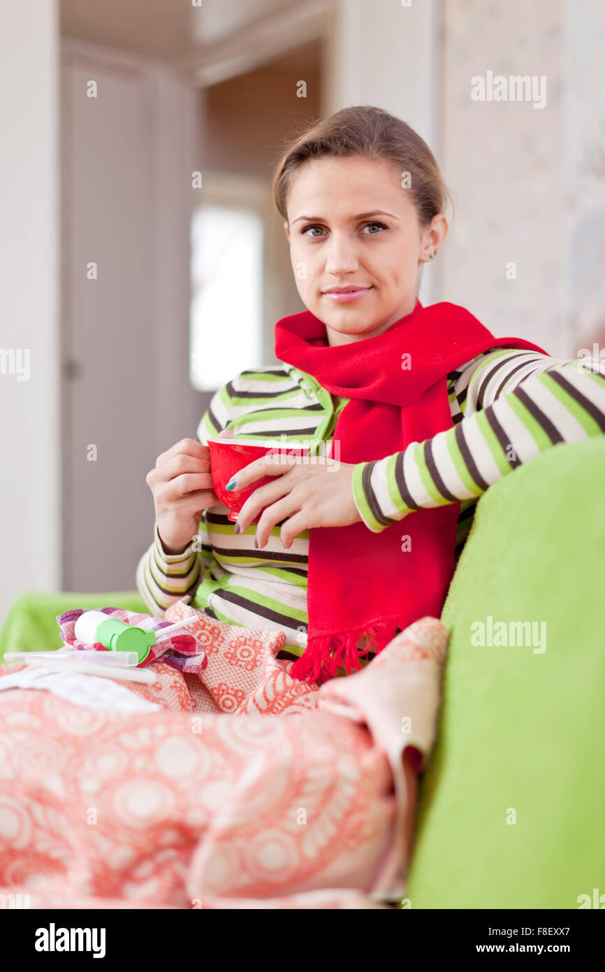 Young illness woman drinking hot tea in blanket Stock Photo Alamy