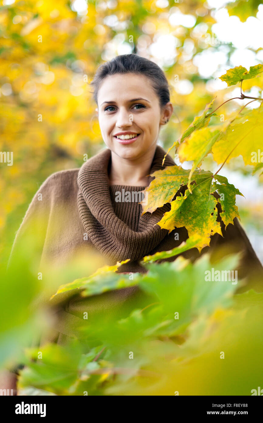 Portrait of beauty woman in autumn park Stock Photo - Alamy