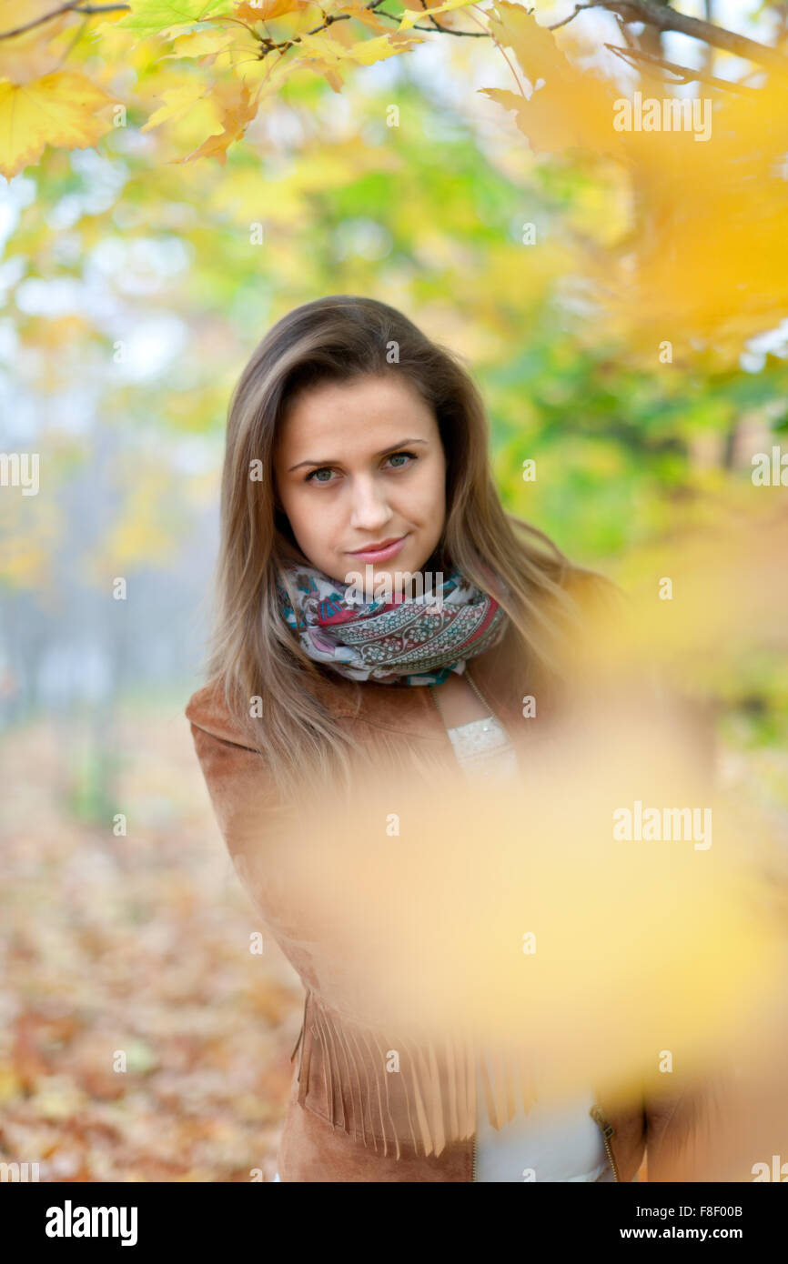 Portrait of beauty girl in autumn park Stock Photo - Alamy