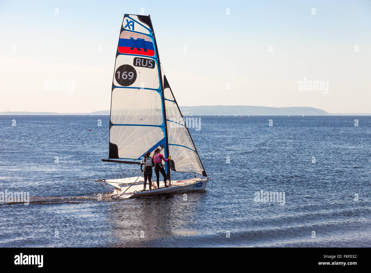 Two girls run sports sailing on the Volga River in sunny day Stock Photo