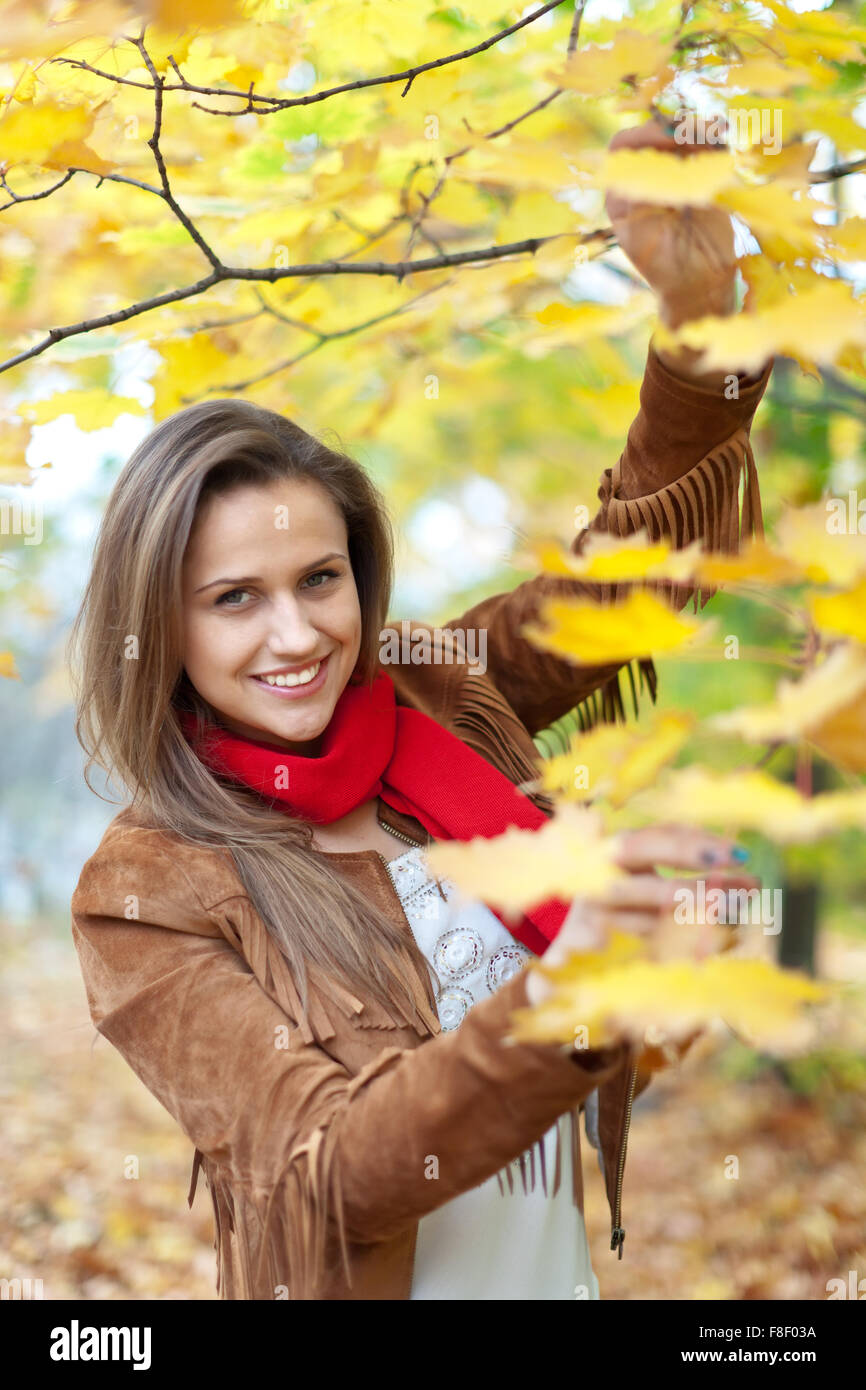 Outdoor portrait of happy girl at autumn park Stock Photo - Alamy