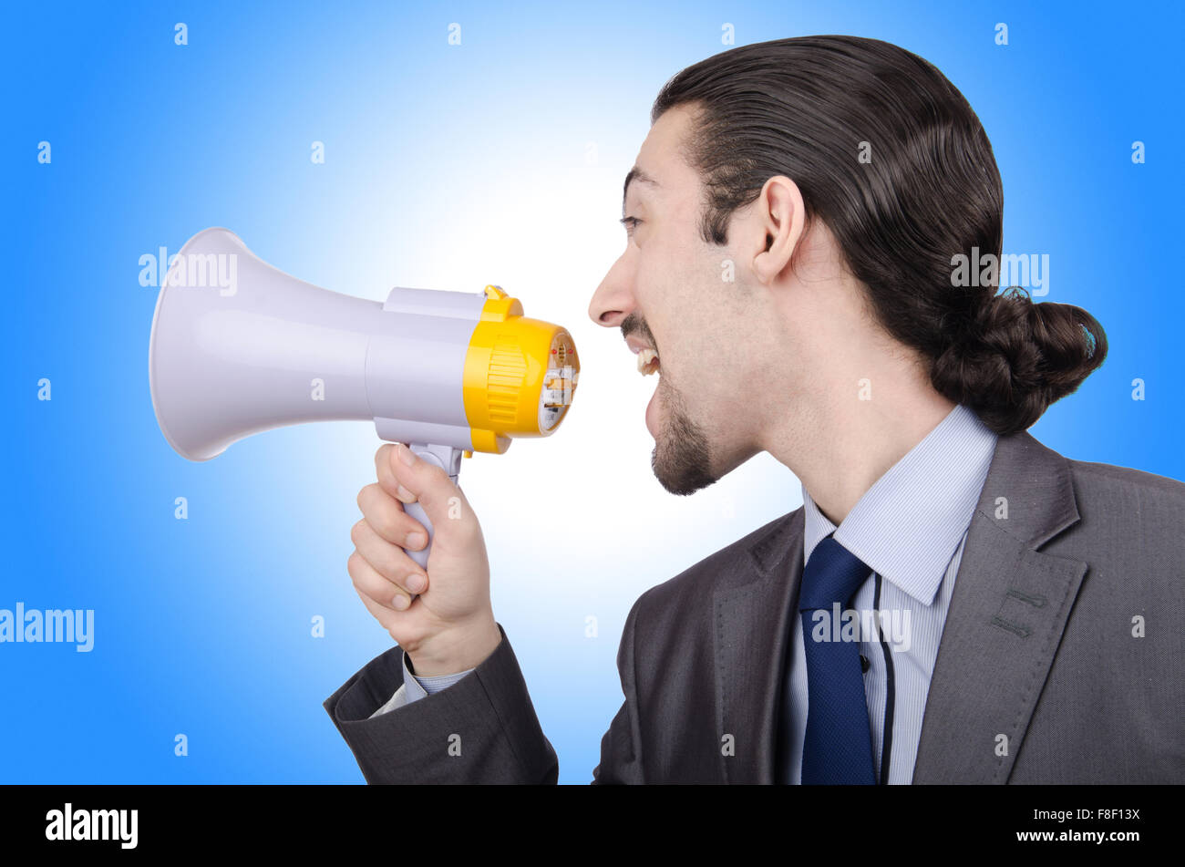 Man shouting and yelling with loudspeaker Stock Photo - Alamy