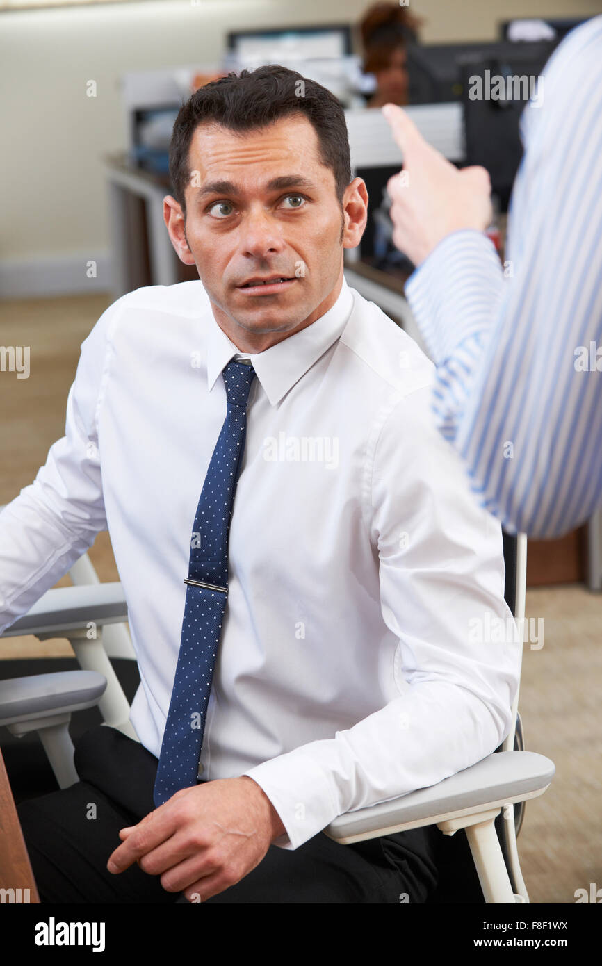 Businessman Being Shouted At By Female Colleague Stock Photo Alamy
