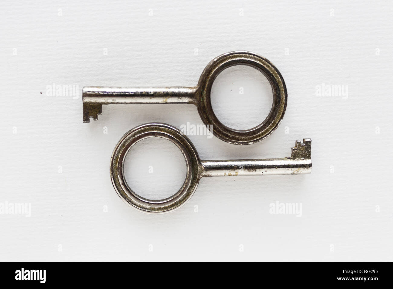 pair of keys on white background - vintage objects Stock Photo