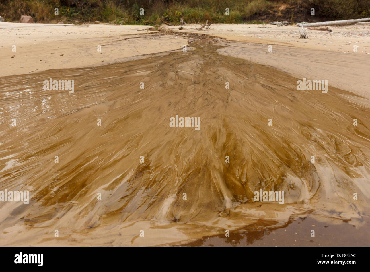 Water flowing into sea Stock Photo