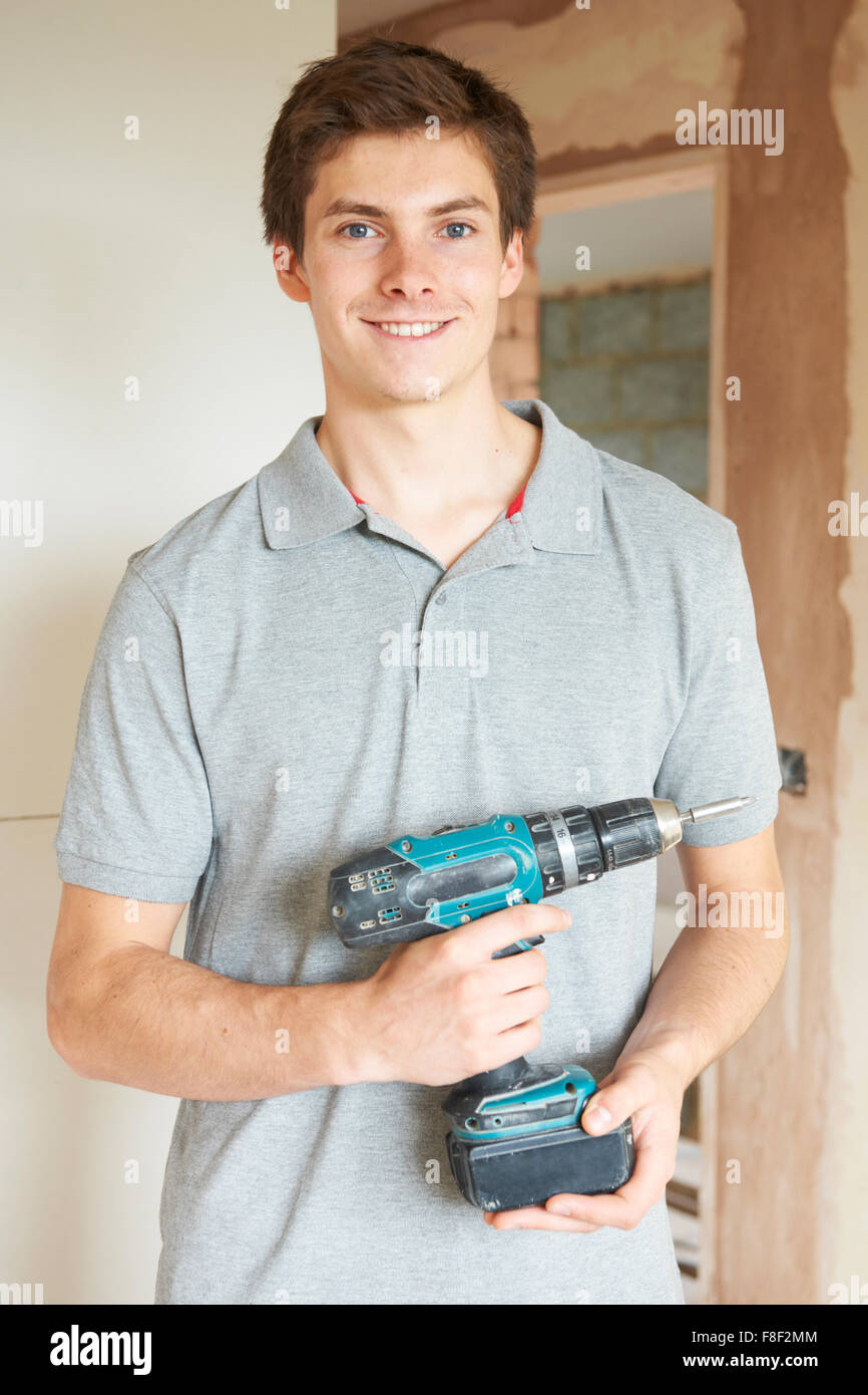 Builder Using Power Tool On Site Stock Photo Alamy