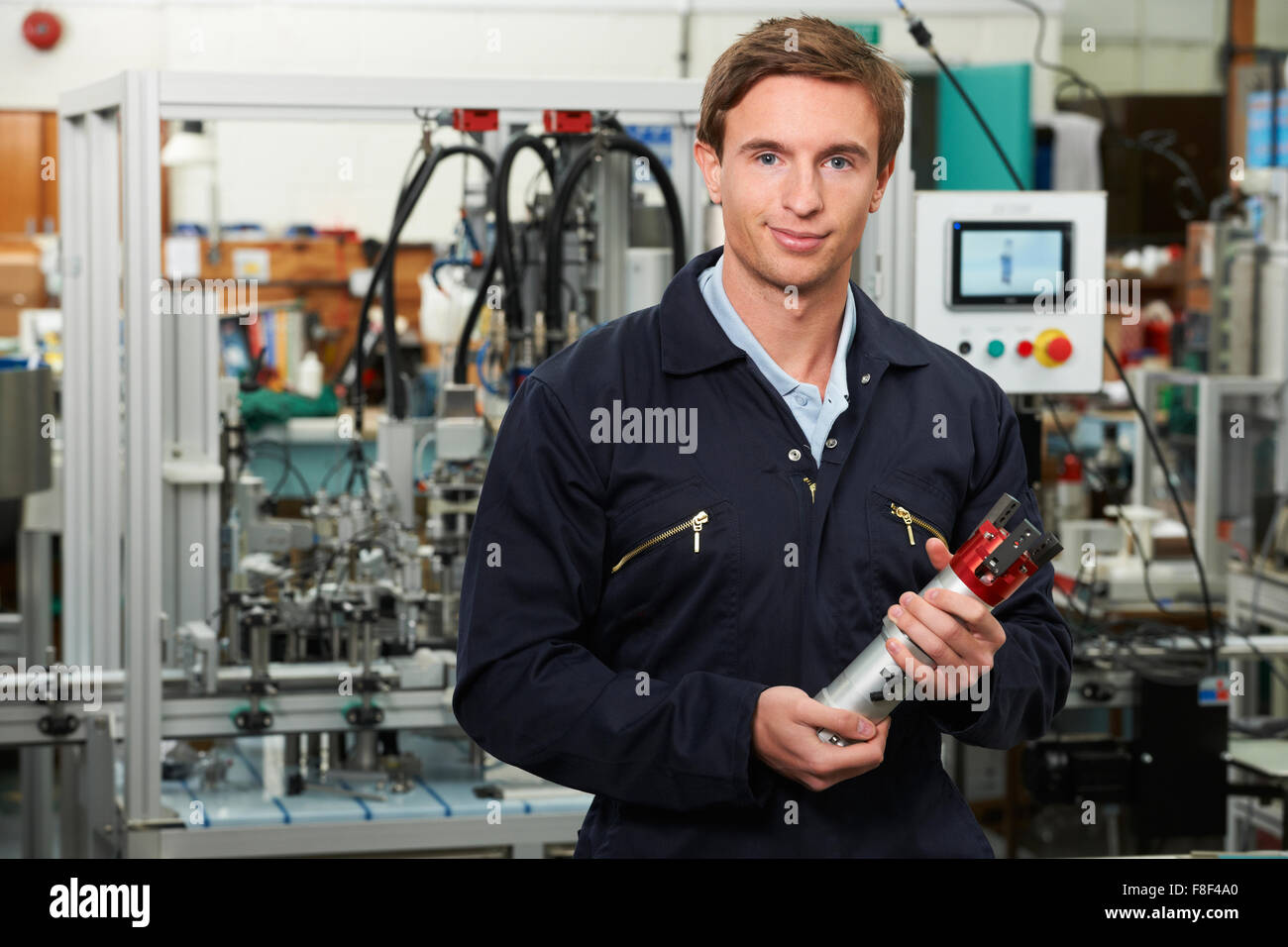 Engineer Checking Component In Factory Stock Photo
