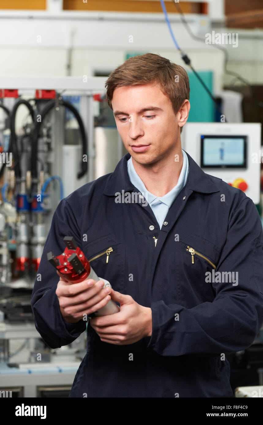 Engineer Checking Component In Factory Stock Photo