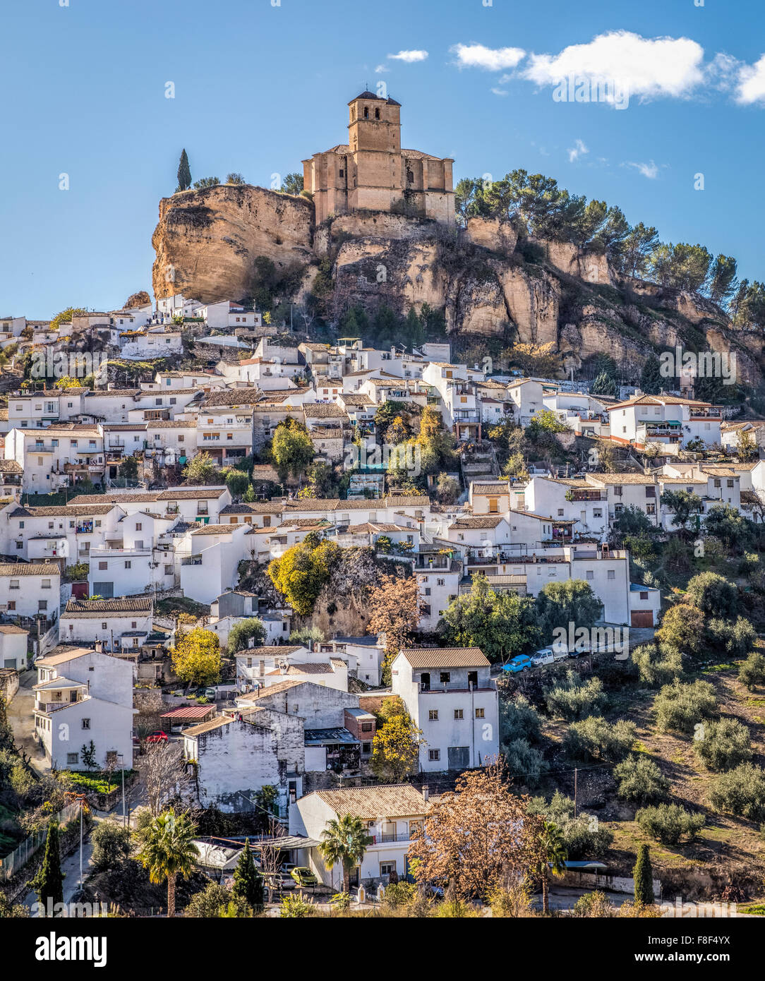 Spanish village of Montefrio in the Province of Granada with its white houses and church on top of the mountain. Stock Photo