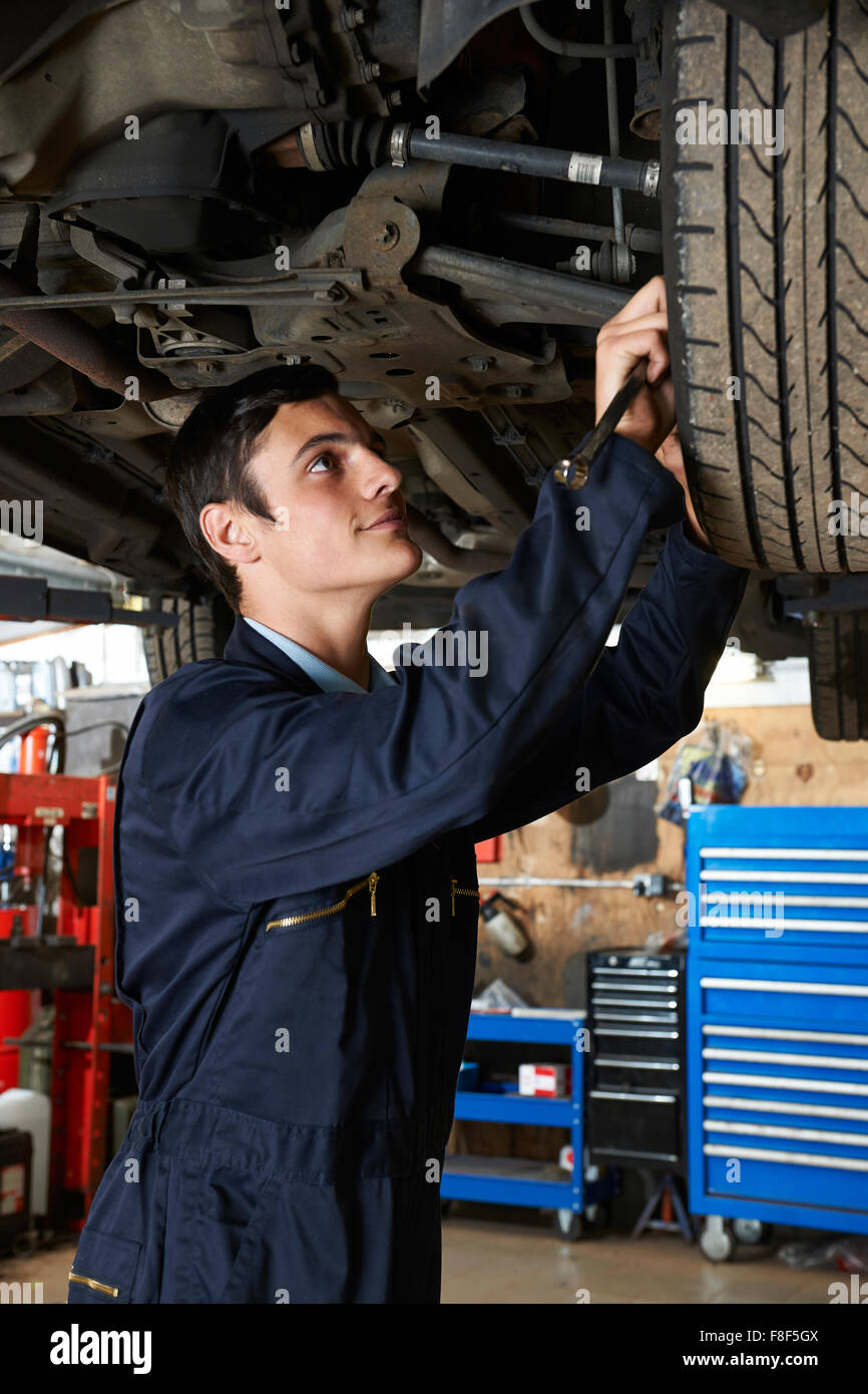 Trainee Mechanic Working Under Car Stock Photo Alamy