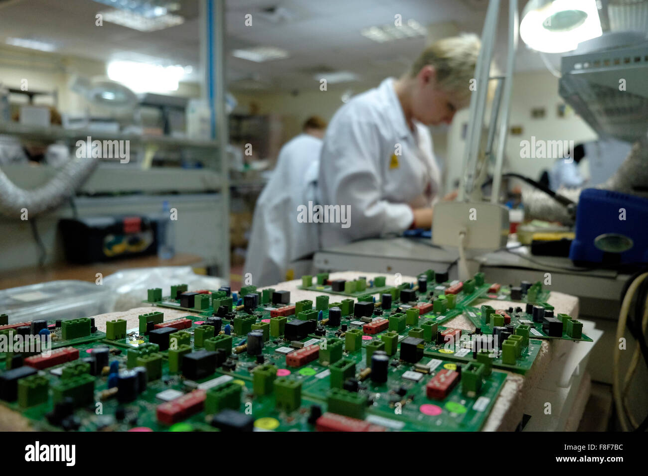 Israel, West Bank. 9th December, 2015. A Russian Jewish immigrant employee from Ariel working at Rolbit factory an Israeli owned factory which produces electronic goods in Barkan Industrial Park situated in Samaria, next to the Jewish settlement Barkan in the West Bank, Israel on 09 December 2015. The European Union’s executive laid out recently guidelines for labeling products from Israeli settlements in occupied Palestinian territories. Israel stressed that sanctions against this industry pose a threat to the mutual financial cooperation in the region. Stock Photo