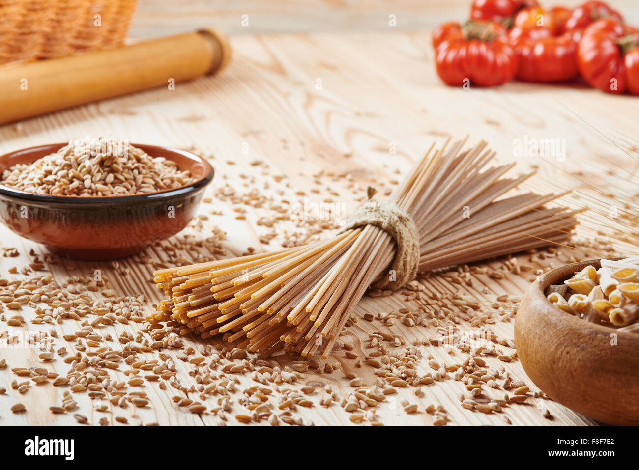 whole wheat pasta noodles surrounded by wheat Stock Photo Alamy