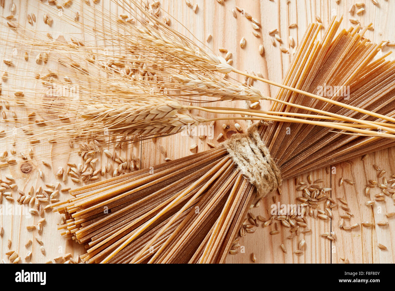 wheat pasta noodles surrounded by whea Stock Photo