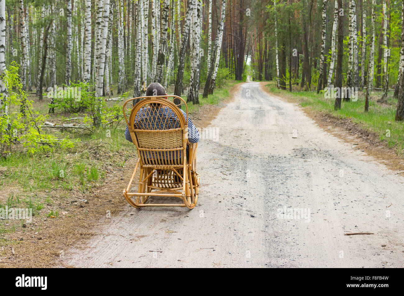 Man sitting on rocking chair hi-res stock photography and images - Alamy