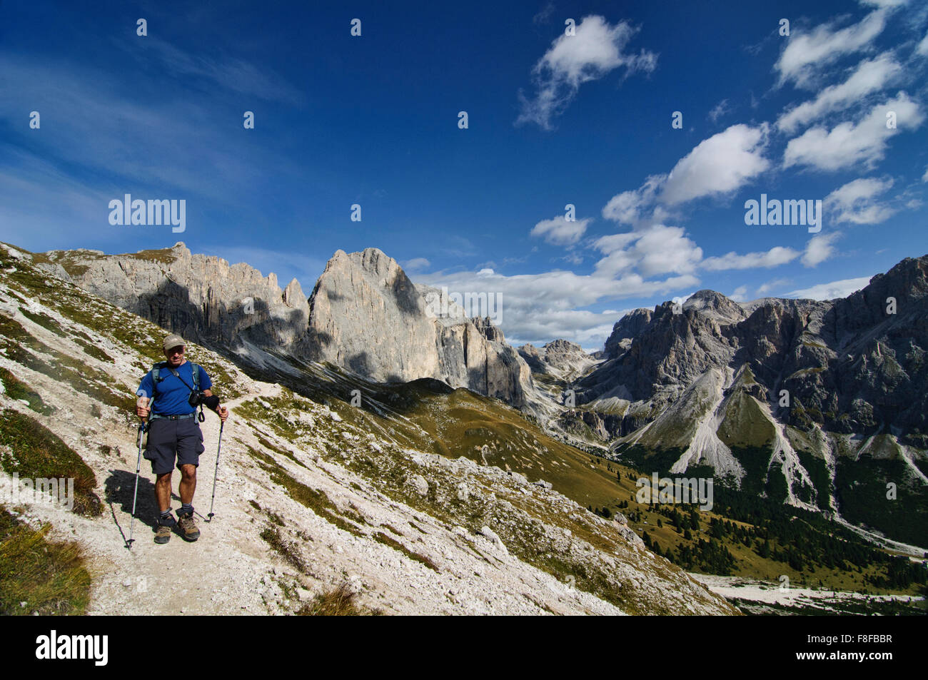 Trekker at Cinque Torri di Averau from Nuvolau, Dolomites, Belluno, Italy Stock Photo