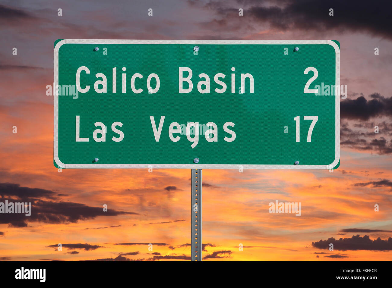 Las Vegas highway sign with sunset sky Stock Photo Alamy