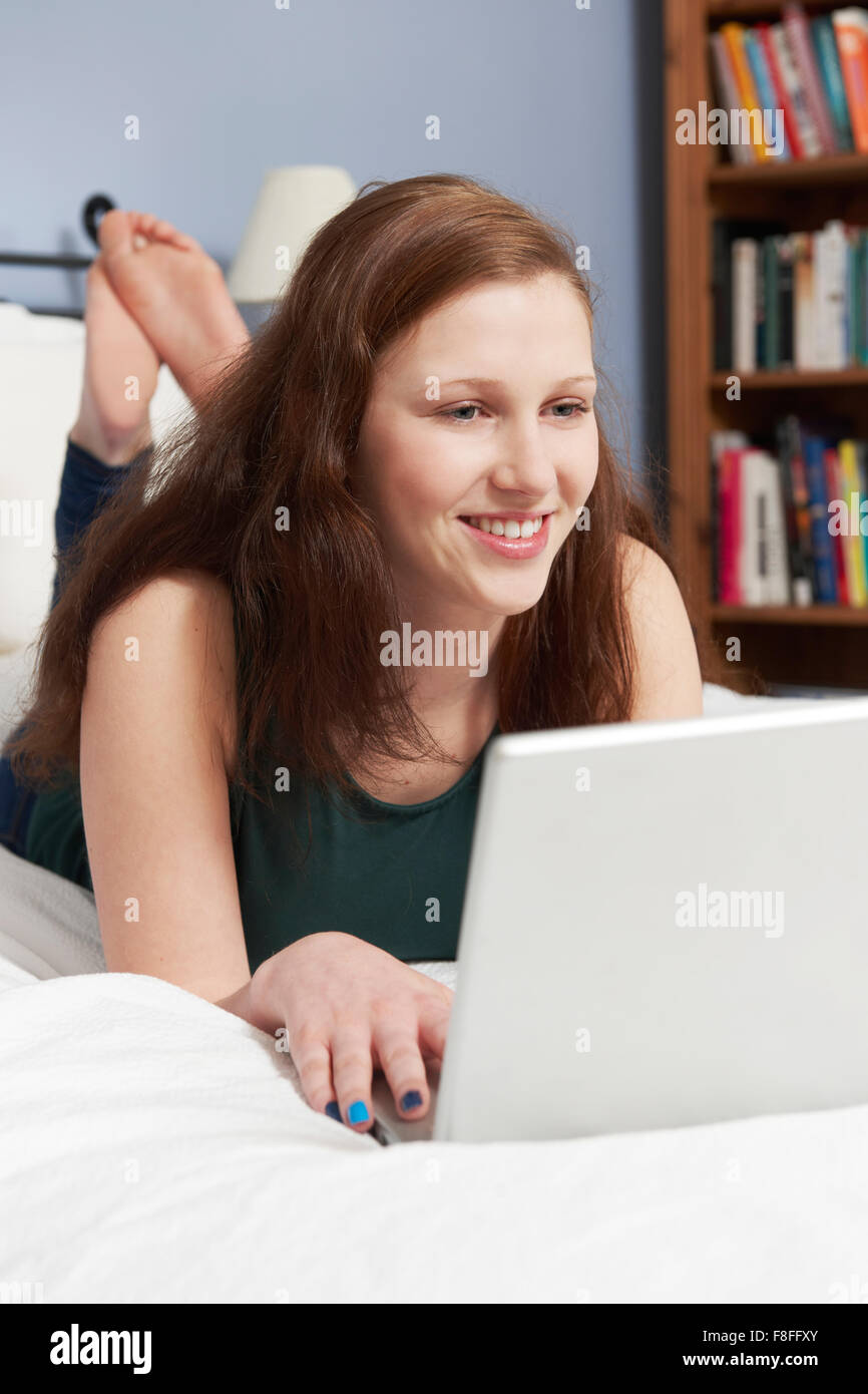 Girl on laptop bedroom hires stock photography and images Alamy