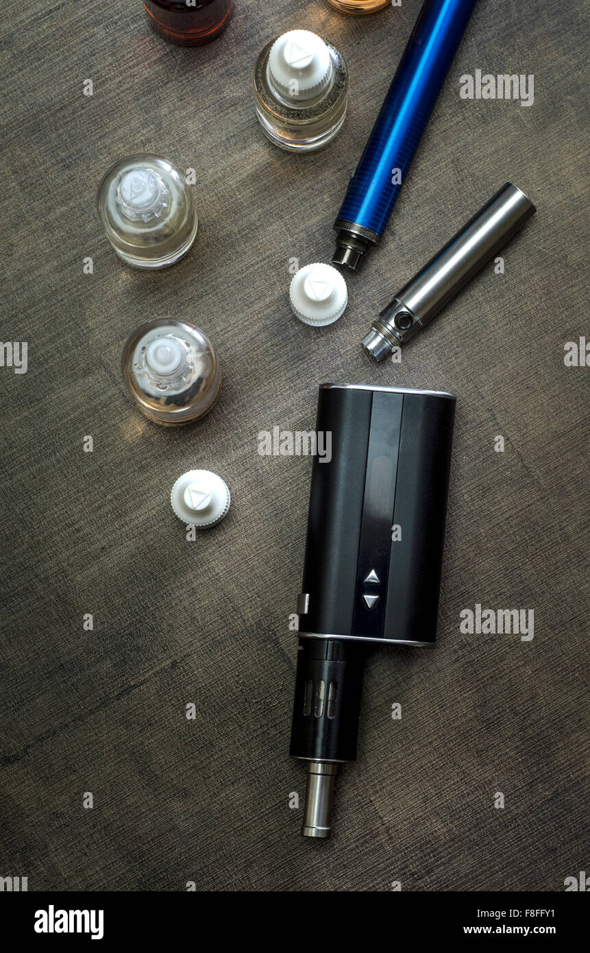 e-cigarettes with lots of different re-fill bottles,from above Stock Photo