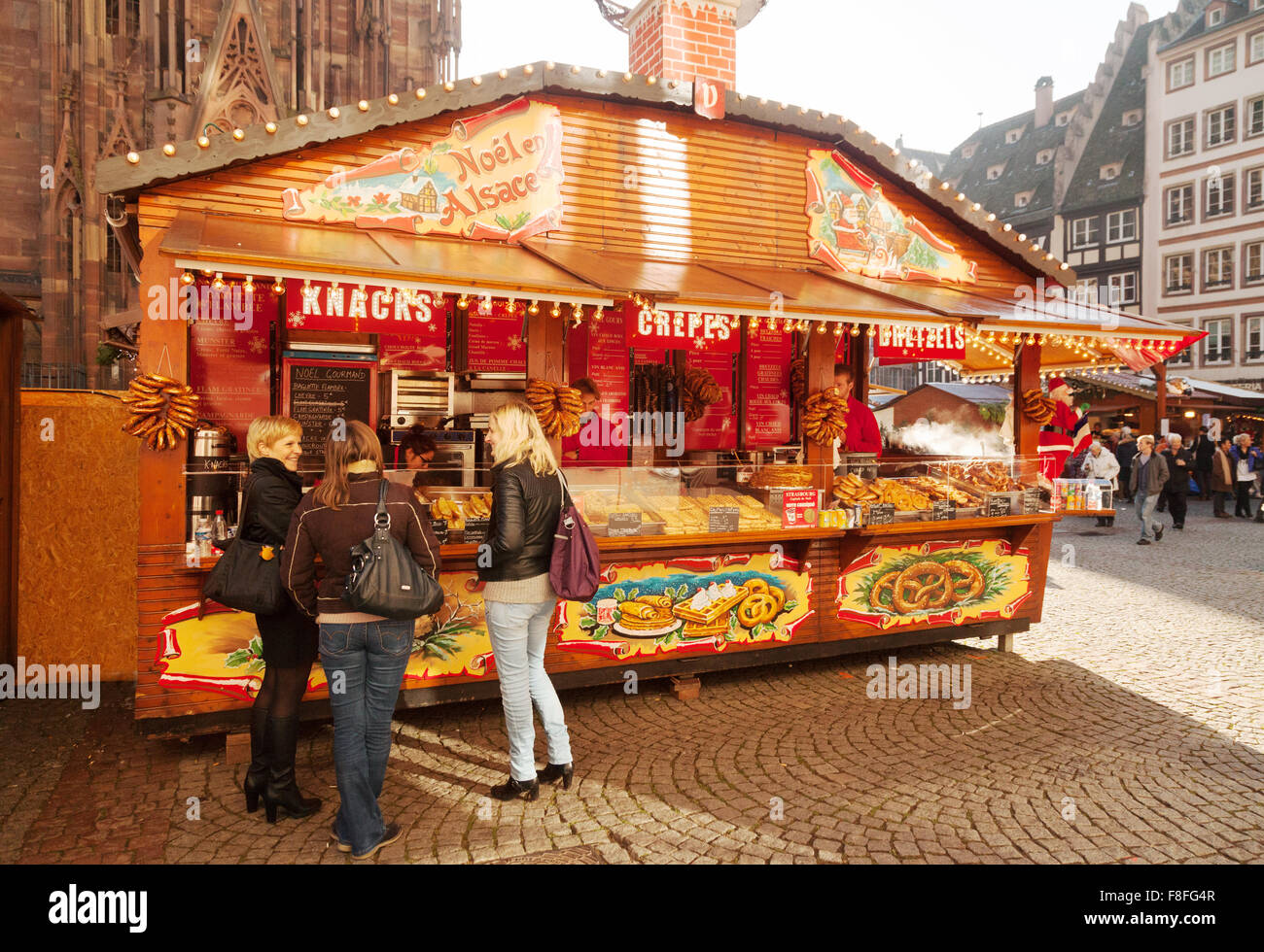 Christmas market stall selling food by the cathedral, Strasbourg Christmas market, Alsace France Europe Stock Photo