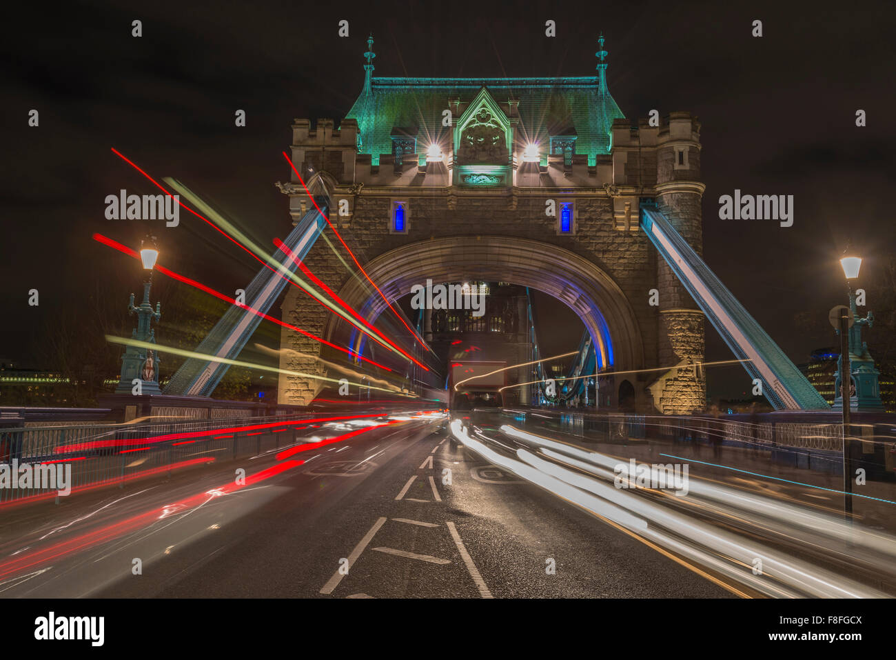 Traffic light trails on Tower Bridge in London at night Stock Photo - Alamy