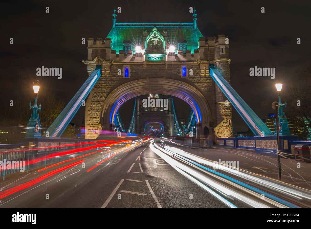 Traffic light trails on Tower Bridge in London at night Stock Photo - Alamy