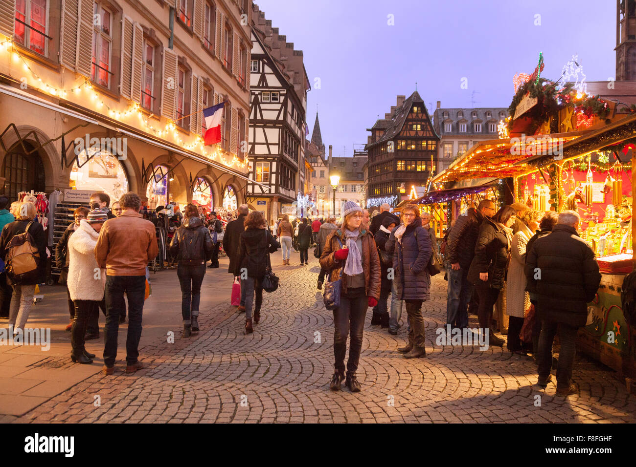 People shopping at Strasbourg Christmas market, Place de la cathedrale, Strasbourg, Alsace, France Europe Stock Photo