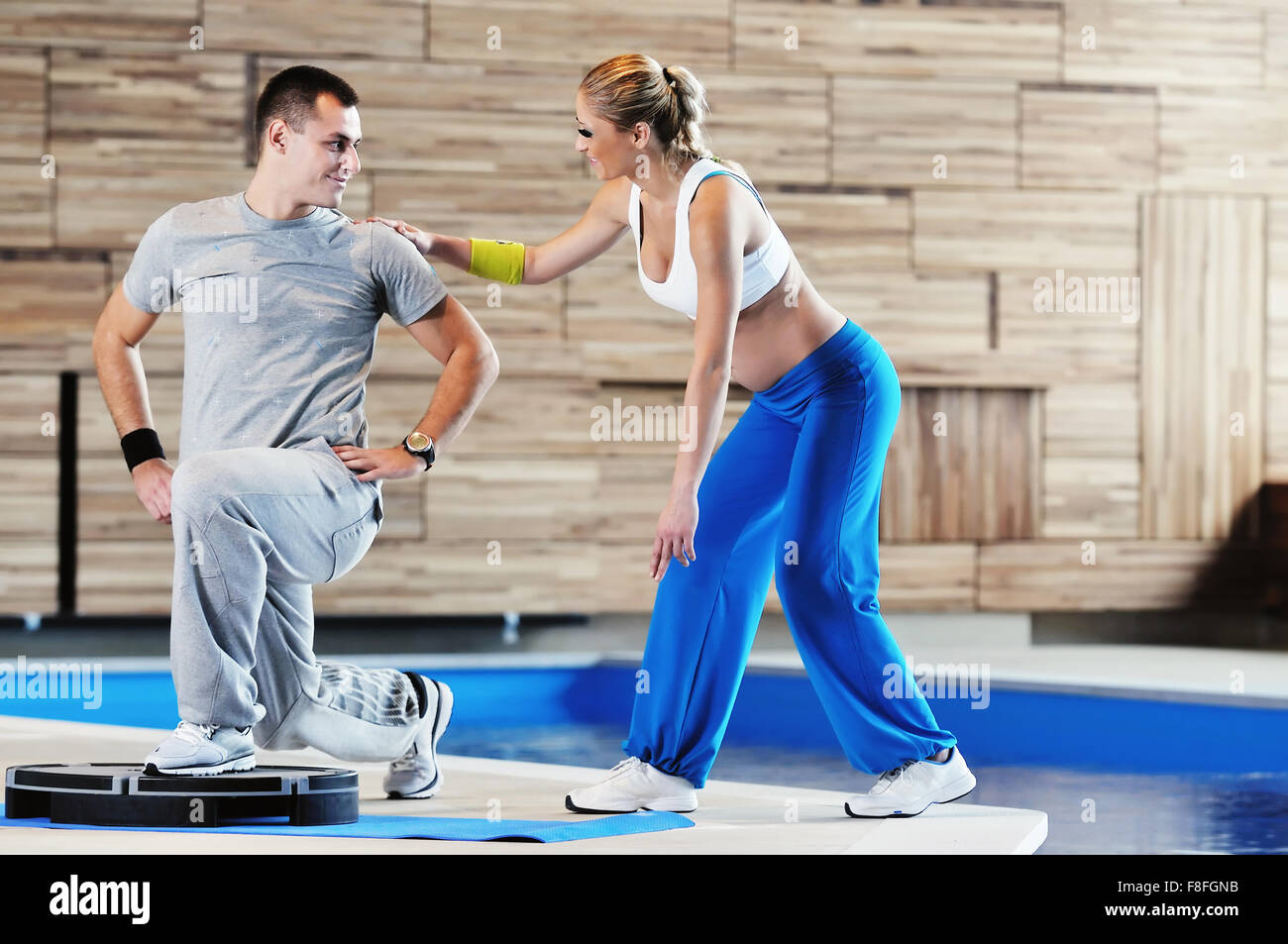 fitness personal trainer on fitness classes supporting group of people