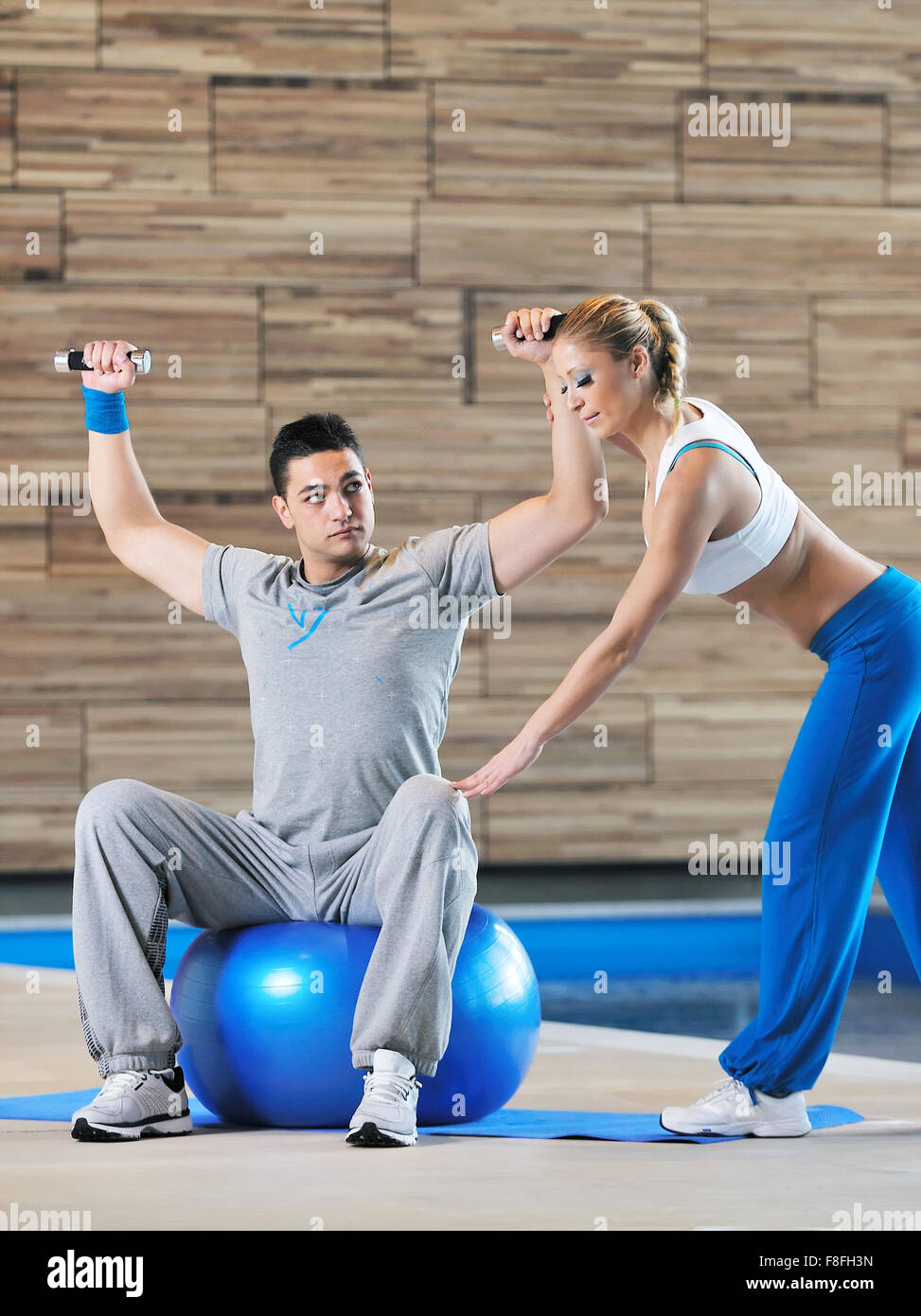 fitness personal trainer on fitness classes supporting group of people