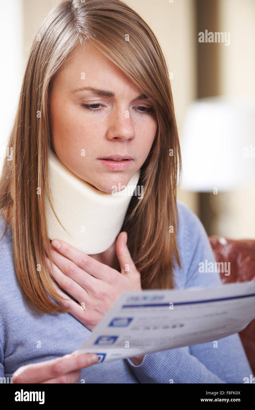 Young Woman Wearing Neck Brace Reading Letter Stock Photo Alamy