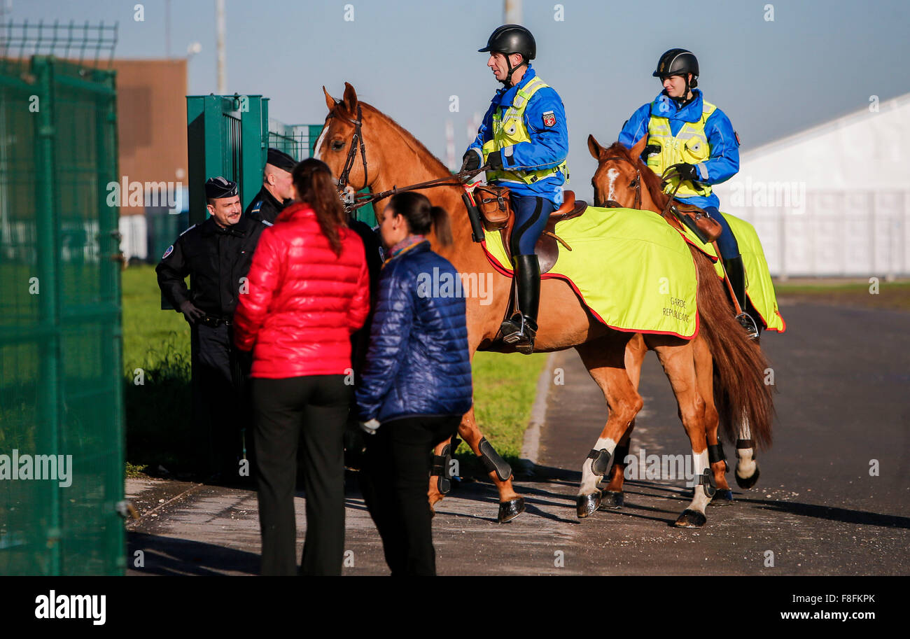 (151209) -- PARIS, Dec. 9, 2015 (Xinhua) -- Police patrol the venue of Paris Climate Change Conference at Le Bourget on the northern suburbs of Paris, France, Dec. 9, 2015. French Foreign Minister and President of Paris Climate Conference Laurent Fabius presented a new clean version of text for a global climate agreement on Wednesday as a basis for further negotiations among countries in the next 48 hours. The main outstanding issues that remain to be resolved include post-2020 climate finance, ambition of action and how to reflect the principle of 'common but differentiated responsibility' in Stock Photo