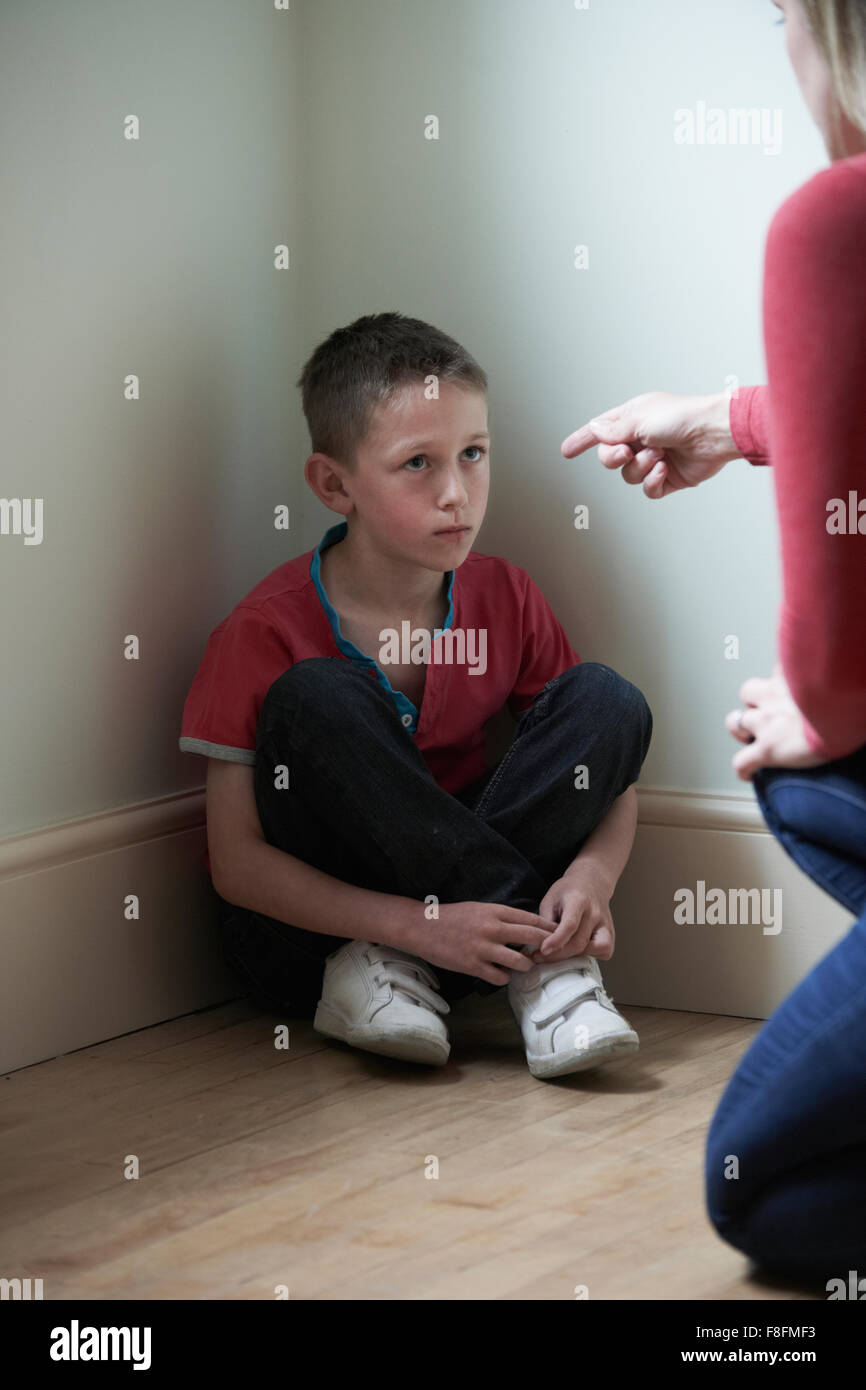 Mother Being Physically Abusive Towards Son At Home Stock Photo