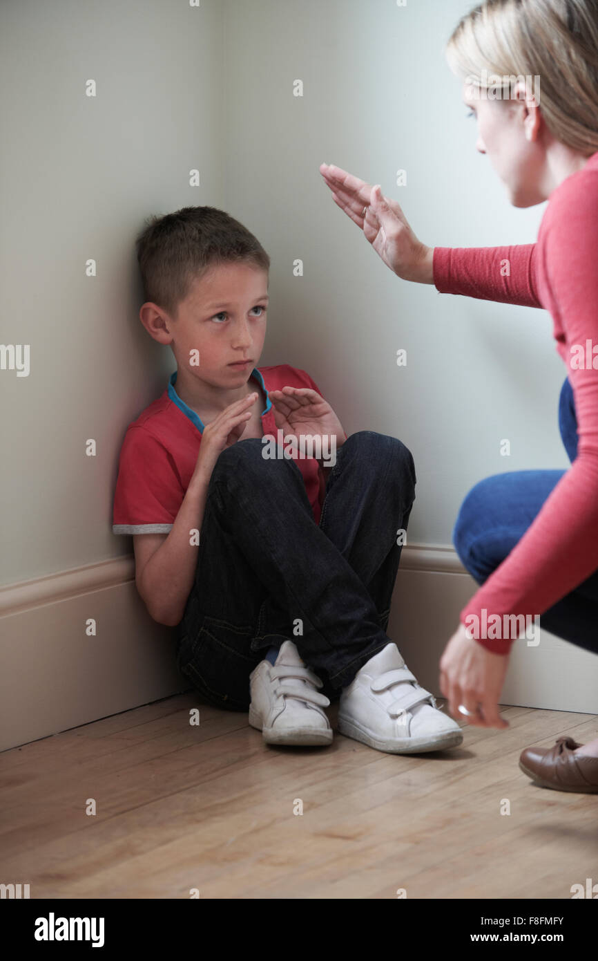 Mother Being Physically Abusive Towards Son At Home Stock Photo