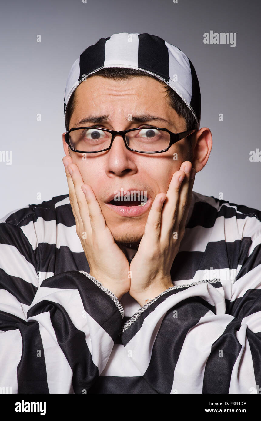Funny prisoner isolated on gray Stock Photo Alamy