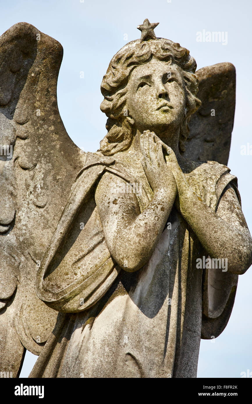 Historic stone sculpture depicting an angel in Church Cemetery