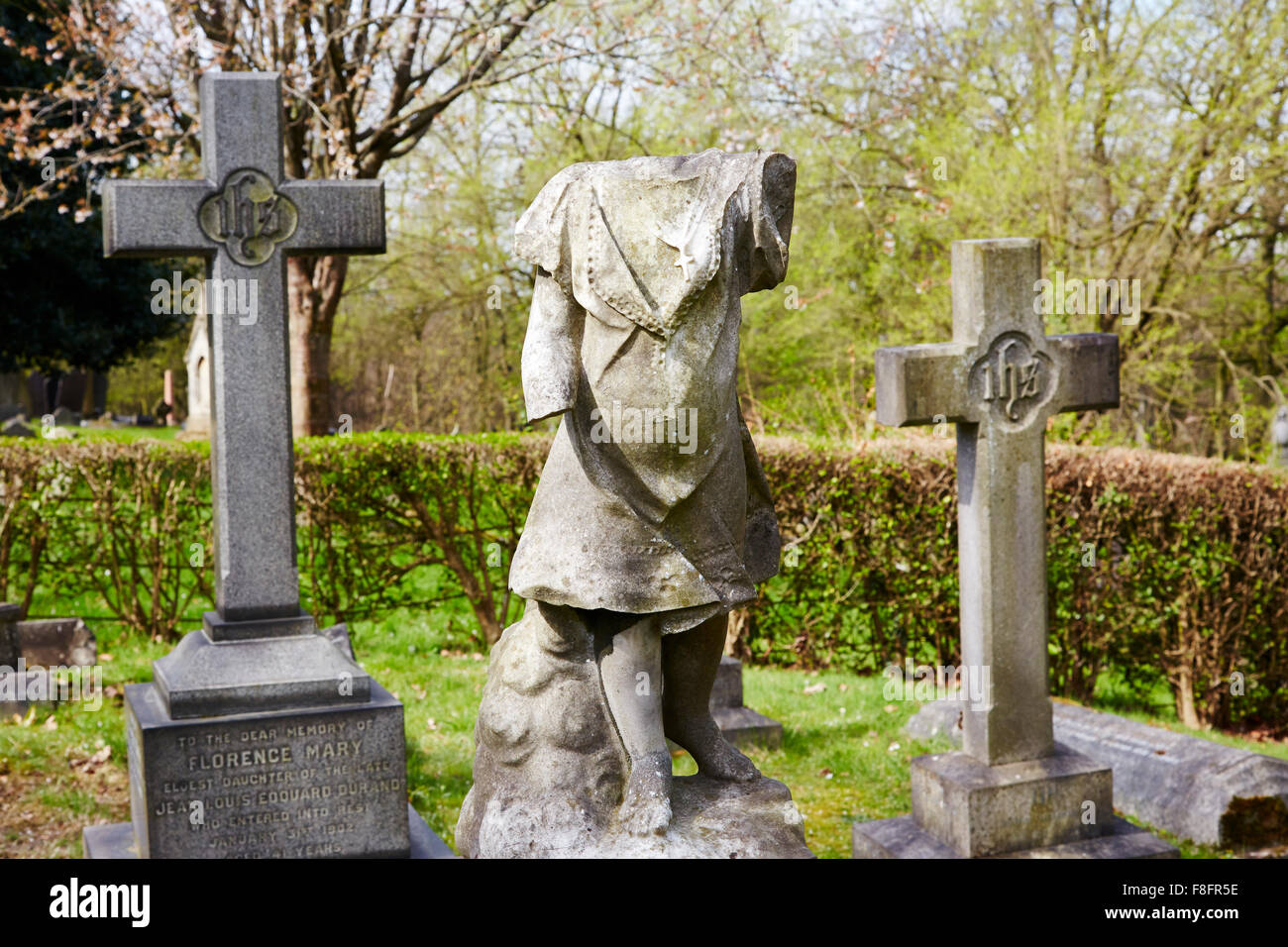 Damaged stone grave statue in Church Cemetery, Nottingham, England, UK. Stock Photo