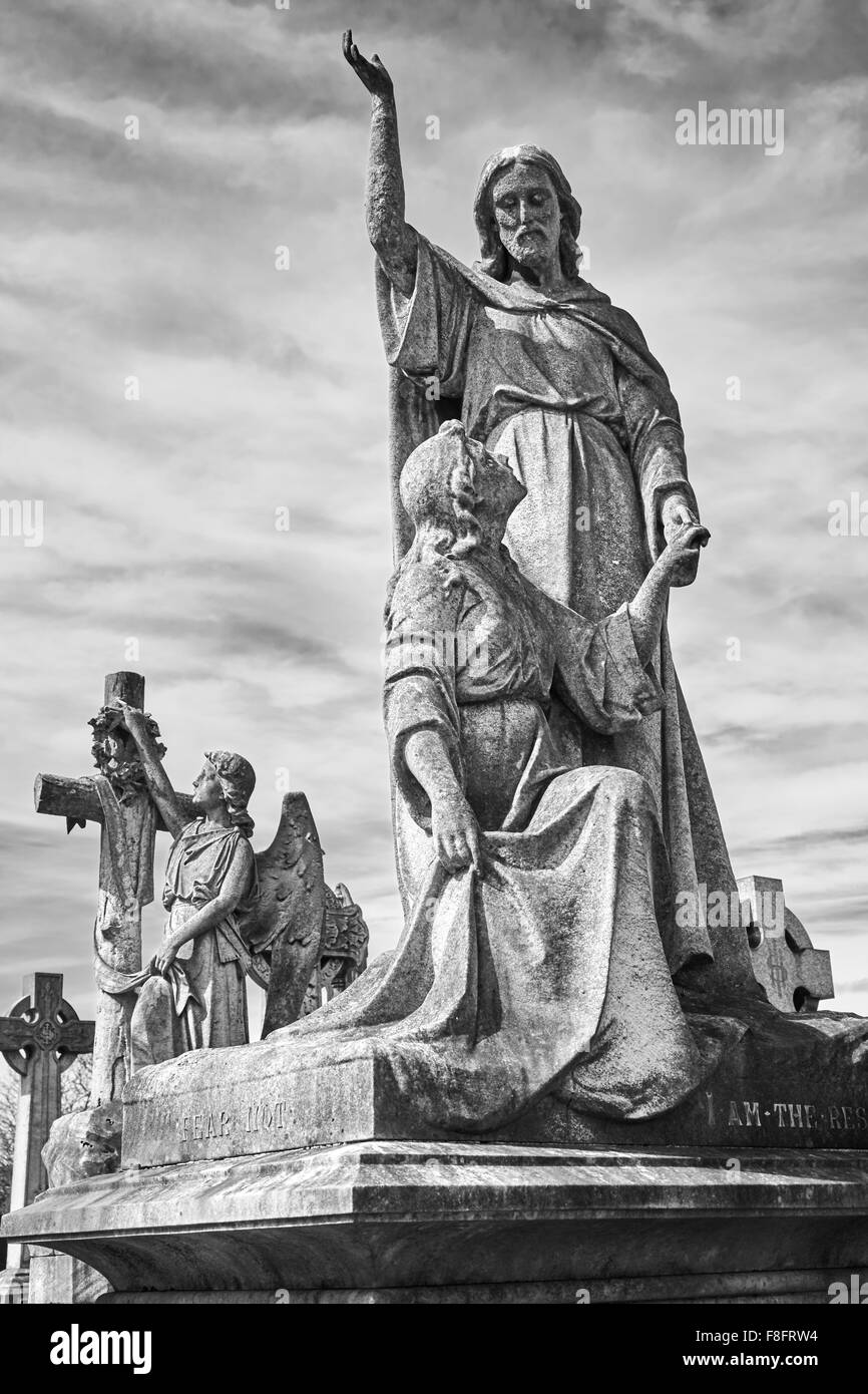 Historic stone sculpture depicting Jesus in Church Cemetery, Nottingham
