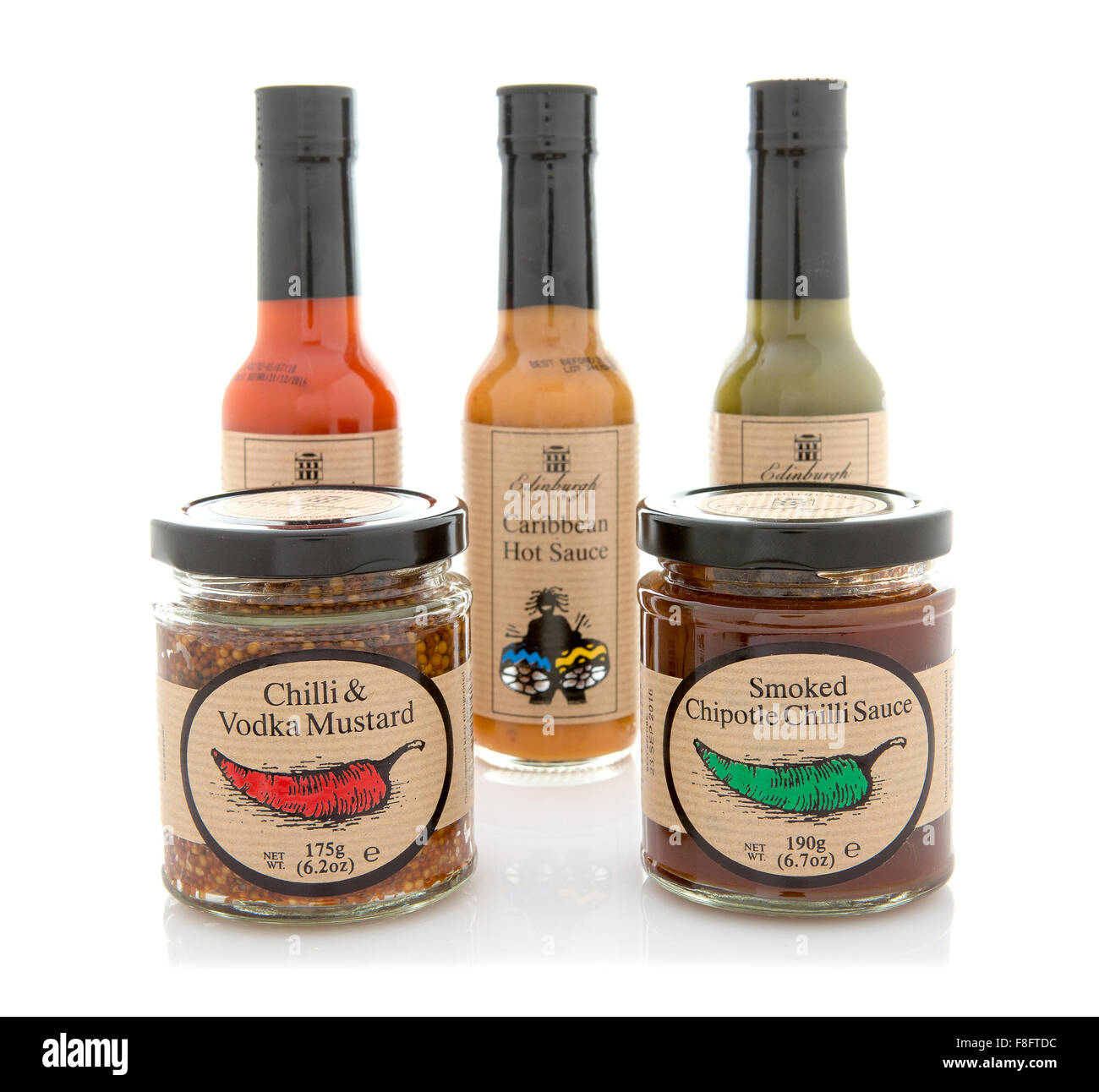 Collection of Sauces with Chilli and Vodka Mustard, Smoked Chipotle Chilli on a White Background Stock Photo