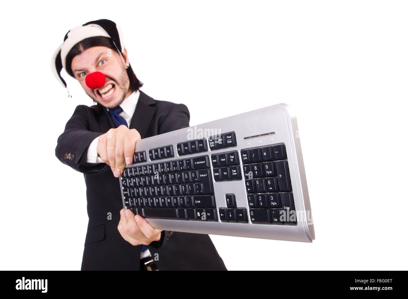 Funny clown with keyboard isolated on white Stock Photo Alamy