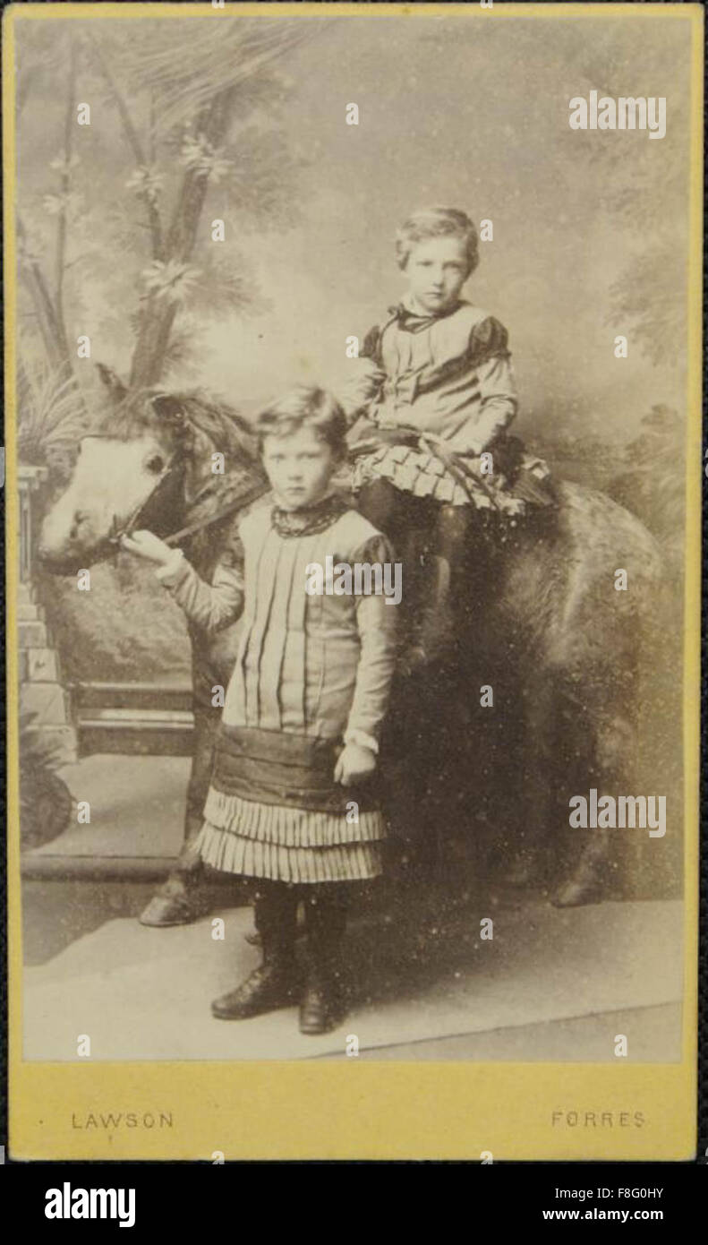 Young children posing in studio with horse, by Lawson, Forres Stock Photo