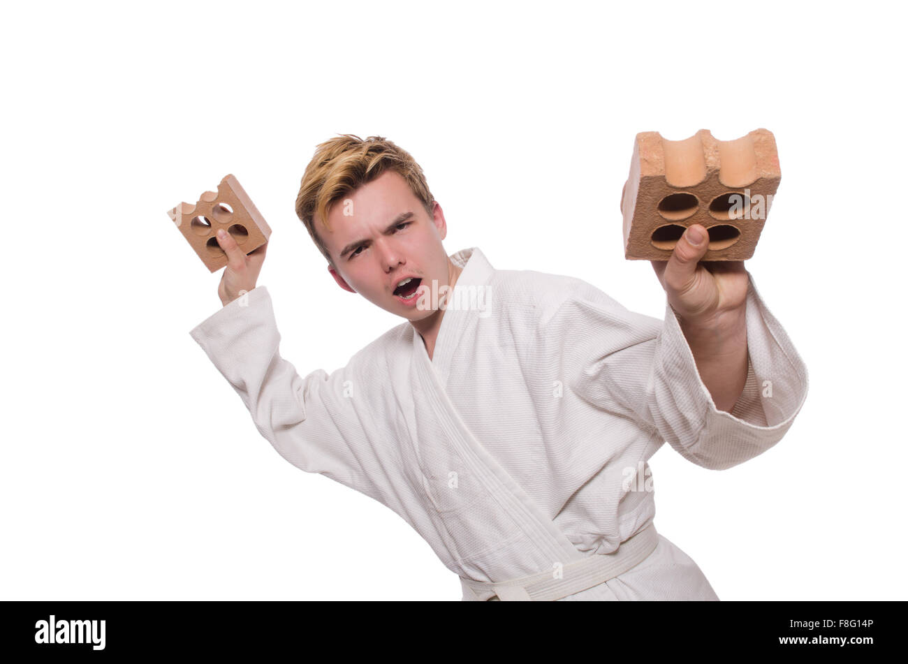 Funny karate man breaking bricks isolated on white Stock Photo Alamy