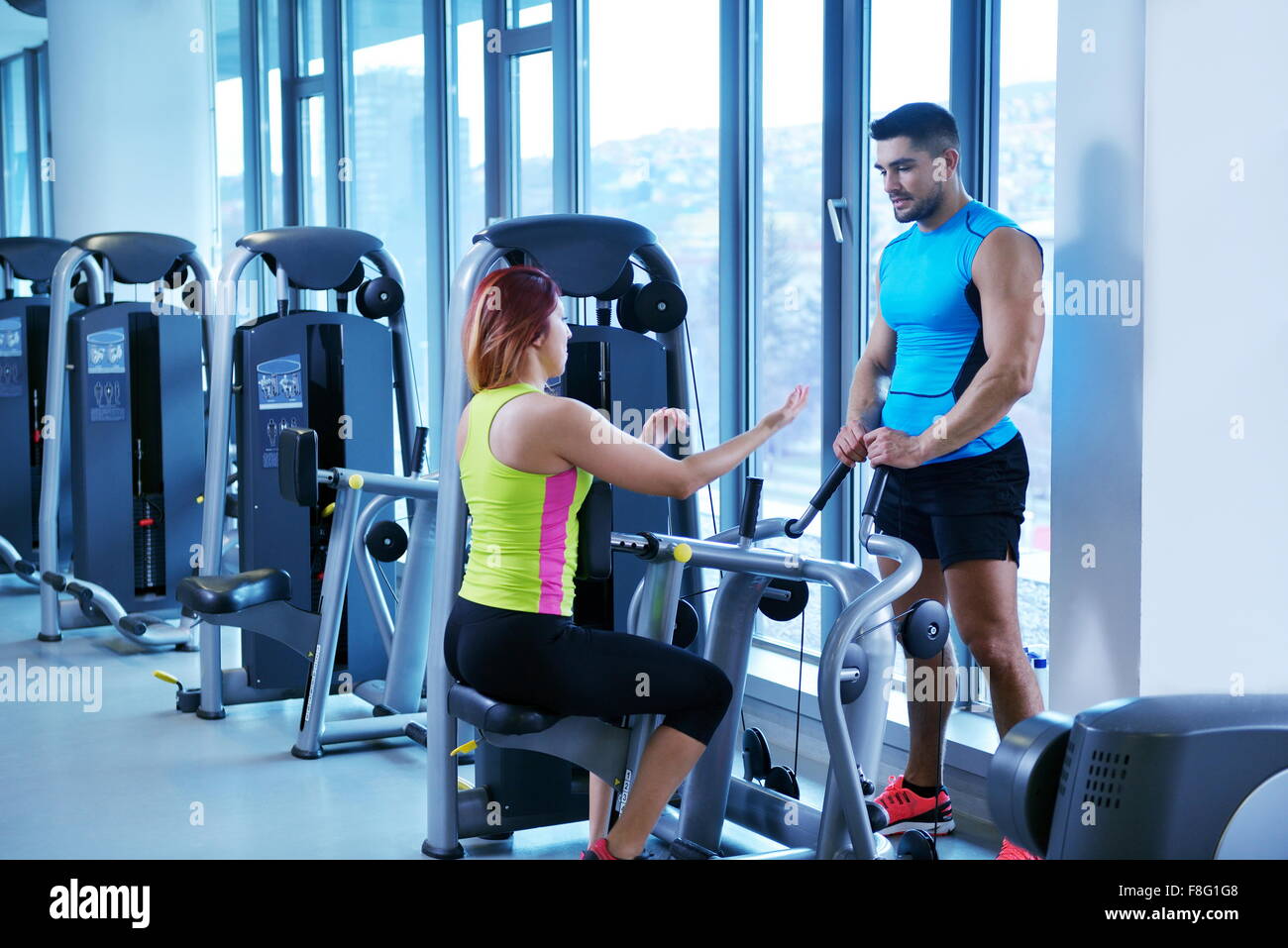 Gym woman exercising with her personal trainer Stock Photo - Alamy