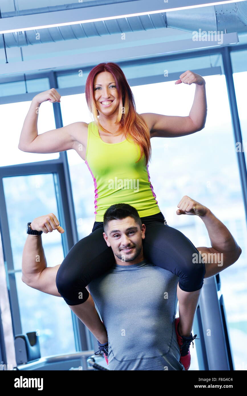 attractive couple at the gym looking happy Stock Photo - Alamy