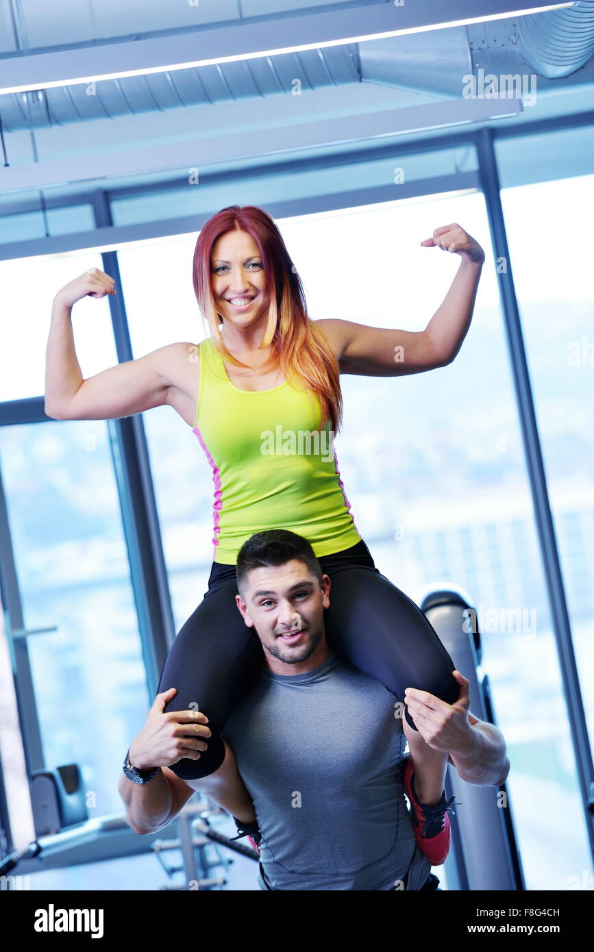 attractive couple at the gym looking happy Stock Photo - Alamy